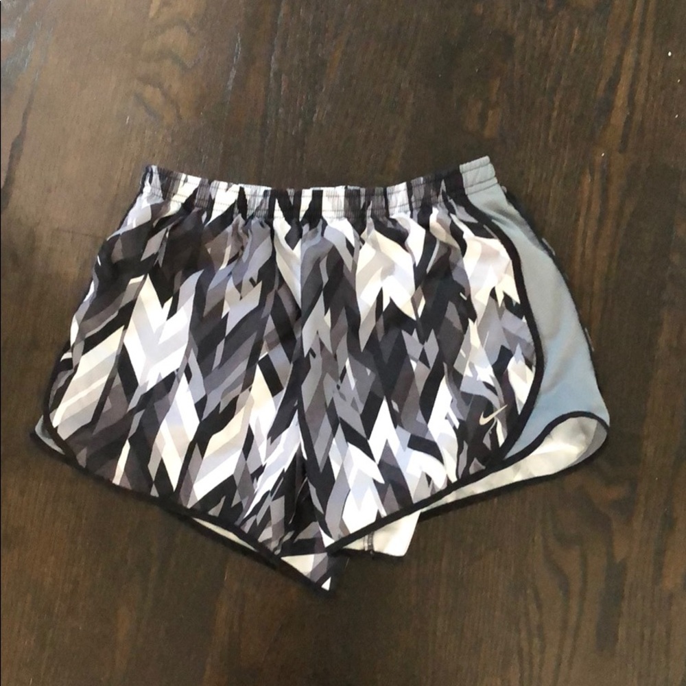 Patterned Nike athletic shorts.